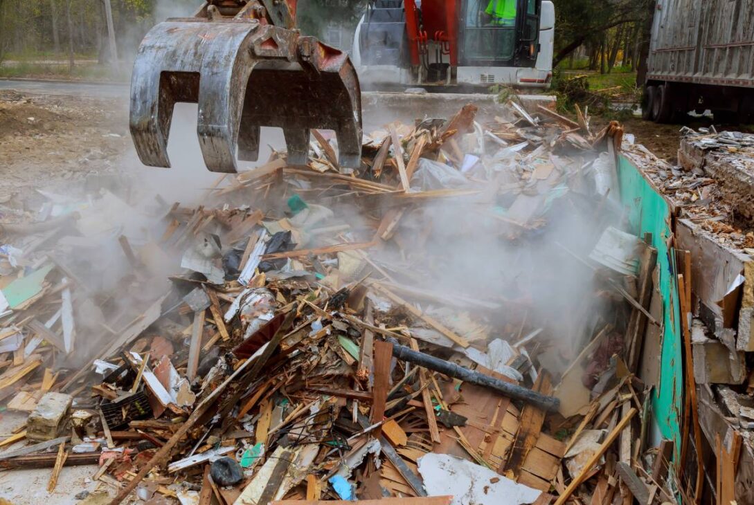 broken house after tragedy excavator disassembles structure tornado